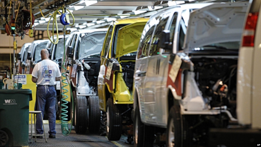 A General Motors employee works on a van assembly line at GM's plant in Wentzville, Missouri, November 3, 2011.