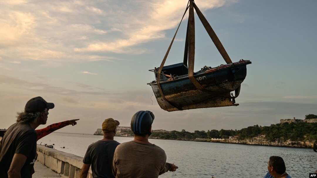Fishermen remove their boats from the water ahead of the arrival of then-Tropical Storm Rafael in Havana on Nov. 5, 2024.