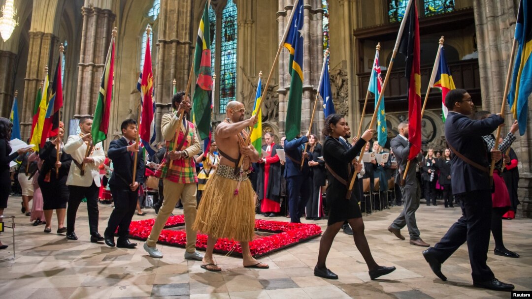 Flags of the Commonwealth being paraded through the Abbey at the Commonwealth Service at Westminster Abbey in London, March 12, 2018.