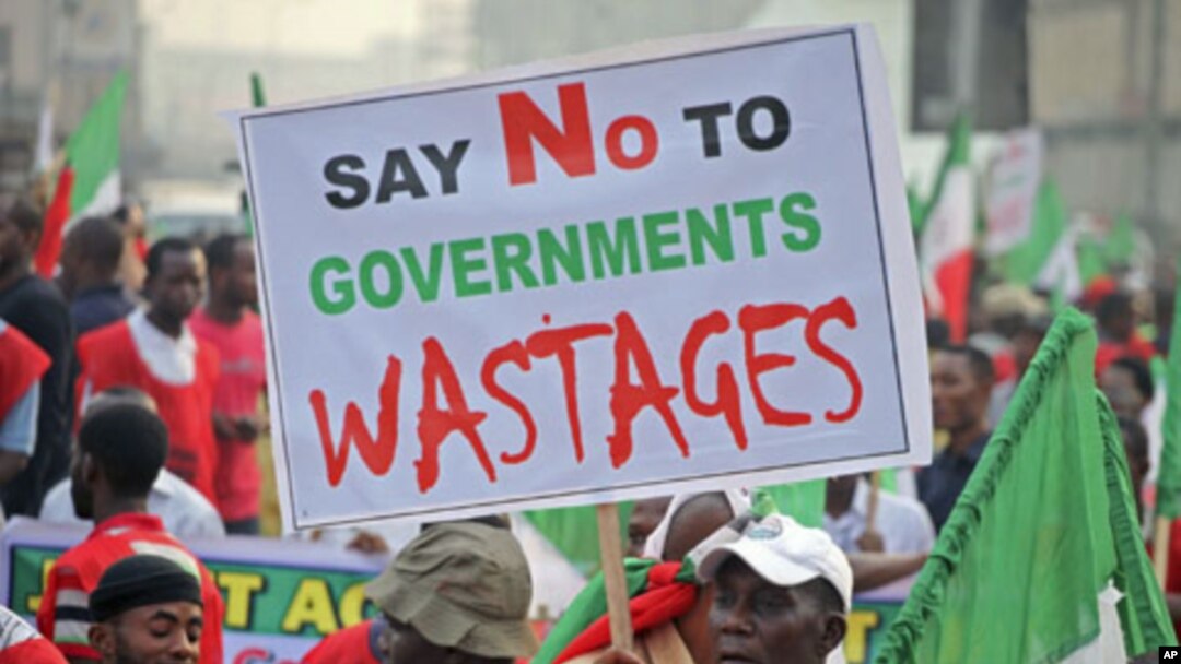 A protester holds a banner during a demonstration against a fuel subsidy removal in Lagos, Nigeria, January 9, 2012.