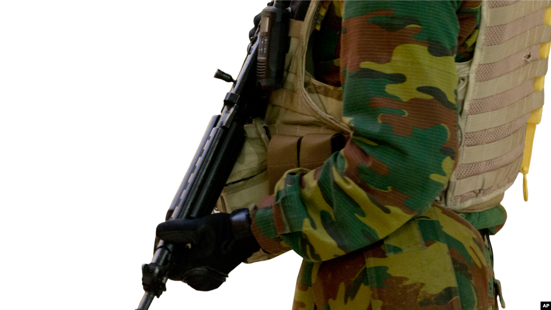 A Belgian Army soldier patrols in the central train station, Brussels, Belgium. That country is on high alert in response to recent terror attacks in Europe.