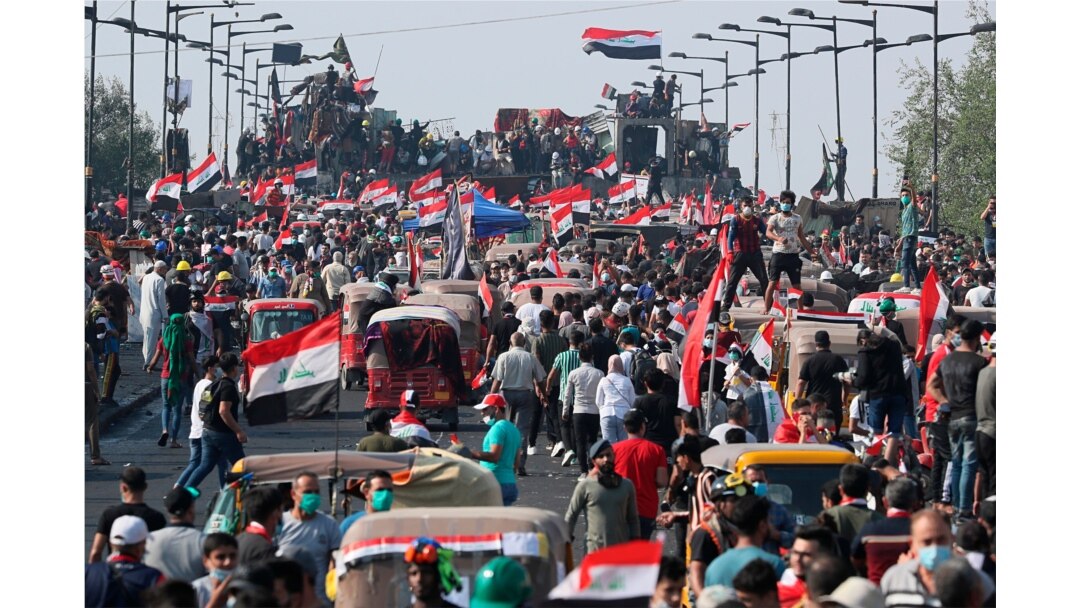 Anti-government protesters gather on the Joumhouriya Bridge leading to the Green Zone, during a demonstration in Baghdad, Iraq, Oct. 31, 2019.