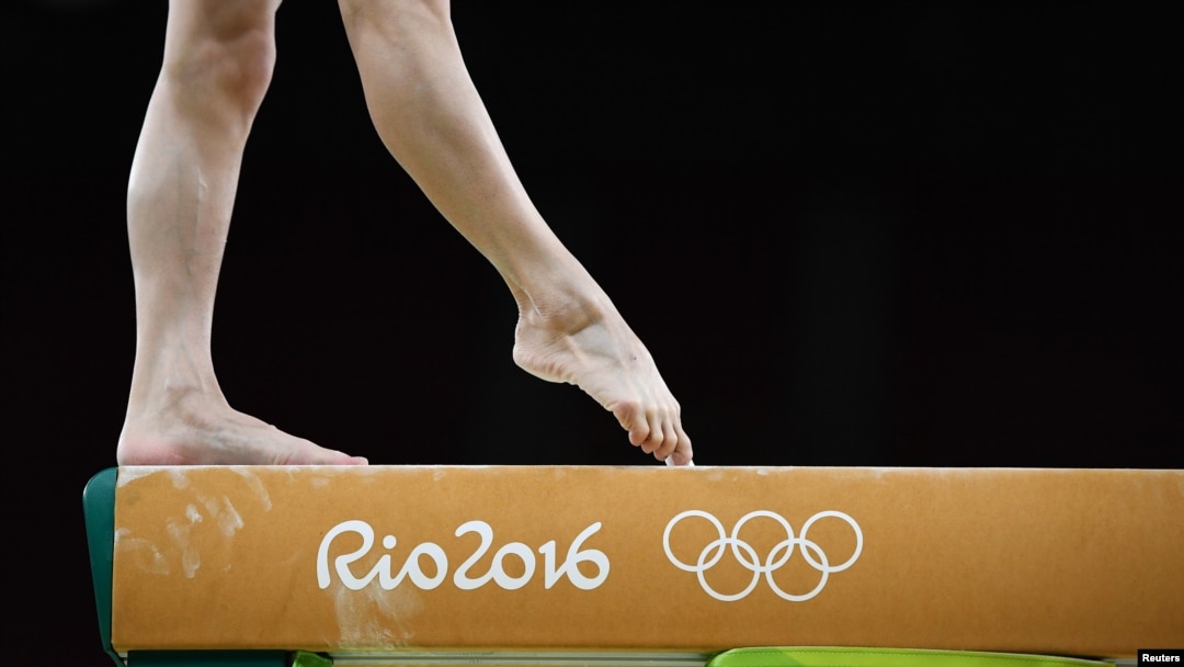 FILE - A member of China's women's gymnastics team is ready to stay on her toes in the 2016 Rio Olympics. (REUTERS/Dylan Martinez)