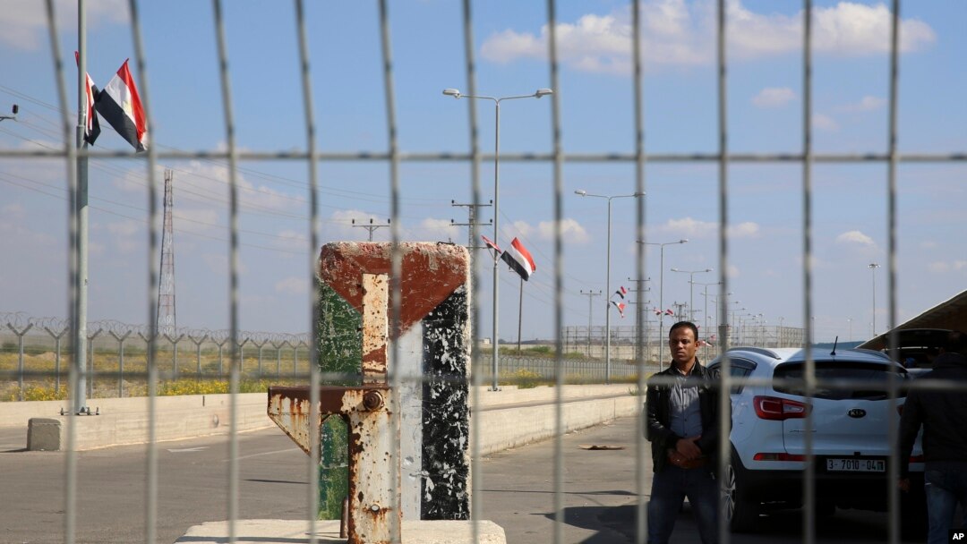 FILE - An employee of the Palestinian Authority stands guard on the Palestinian side of the Erez checkpoint between Israel and Gaza, at Beit Hanoun, Gaza Strip, Nov. 1, 2017. 