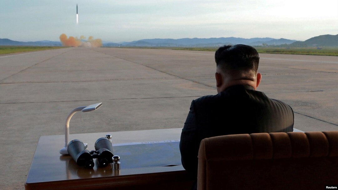 FILE - North Korean leader Kim Jong Un watches the launch of a Hwasong-12 missile in this undated photo released by North Korea's Korean Central News Agency (KCNA).