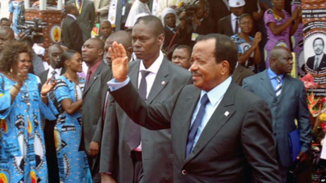 Cameroon's President Paul Biya waves to supporters during the opening of his party conference, in Yaounde, September 15, 2011.
