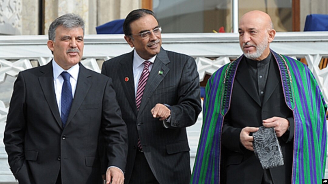 Turkish President Abdullah Gul, left, his Afghan counterpart Hamid Karzai, right, and President Asif Ali Zardari of Palistan walk after a meeting in Istanbul, Turkey. Turkey is hosting a conference this week on creating a regional strategy for improving s