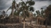 FILE - The remains of a burned and destroyed home is seen in the recently attacked village of Aldeia da Paz outside Macomia, in the Cabo Delgado Province in northern Mozambique, Aug. 24, 2019.