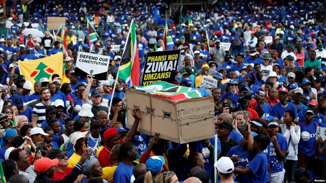 Protesters carry a mock coffin at the Freedom Day rally organized by the newly-formed Freedom Movement in Pretoria, South Africa, April 27, 2017. 