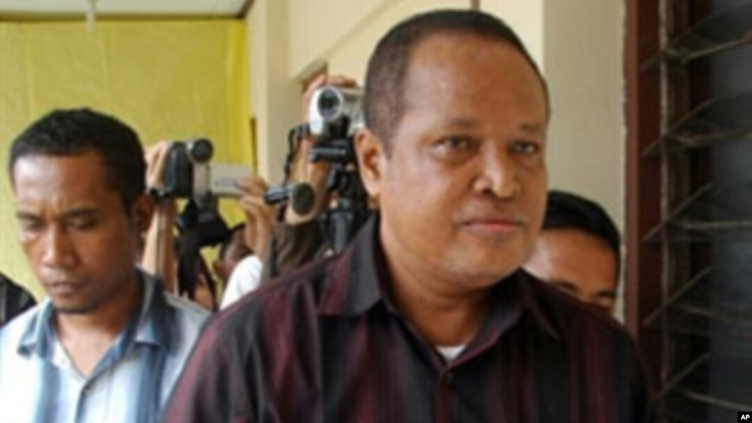 This picture taken in Serang on March 17, 2010 shows Abraham Louhenapessy, also known as Captain Bram, being escorted prior to a trial. The notorious Indonesian people smuggler escaped with a fine rather than a jail sentence after a court on March 24, 20