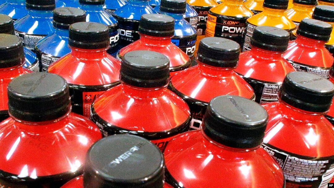 FILE - Sodas and energy drinks line the shelves in a grocery store in Springfield, Illinois, May 18, 2016. The World Health Organization recommends countries use tax policy to increase the price of sugary drinks as a way to fight obesity and diabetes.