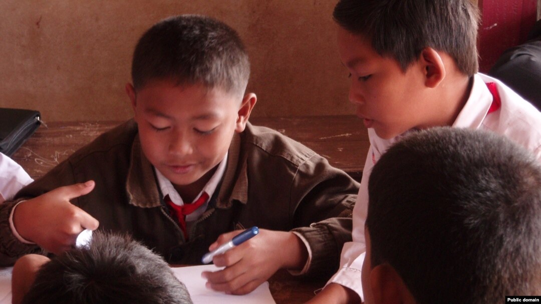 Children working together at school in Laos.