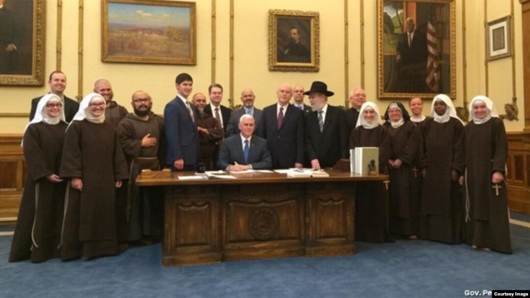 Handout photo from Indiana Governor Mike Pence's office on the signing of the RFRA on March 26.