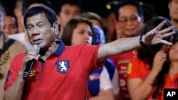 FILE - Philippine presidential race front-runner Davao city mayor Rodrigo Duterte gestures during his final campaign rally in Manila, Philippines, May 7, 2016. 