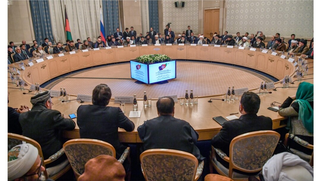 FILE - Participants attend talks between the Taliban and Afghan opposition representatives at the President Hotel, in Moscow, Russia, Feb. 5, 2019.
