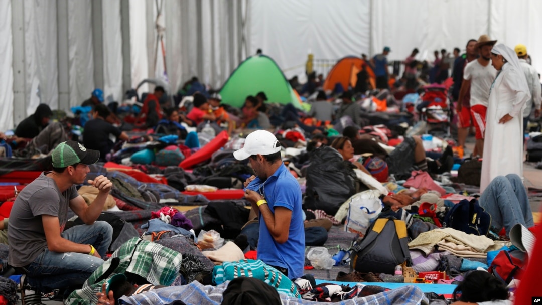 Central American migrants settle in a shelter at the Jesus Martinez stadium in Mexico City, Tuesday, Nov. 6, 2018. 
