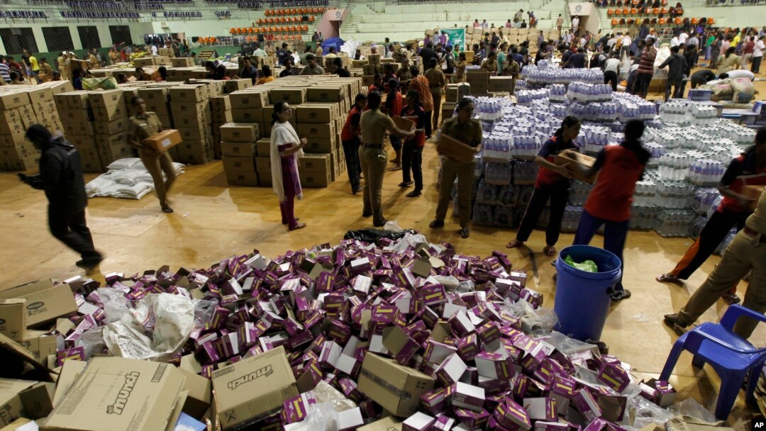 Volunteers sort relief material to be distributed to flood victims in Chennai, India, Dec. 6, 2015. The worst flooding in a century in Tamil Nadu has left scores of people dead since November. 