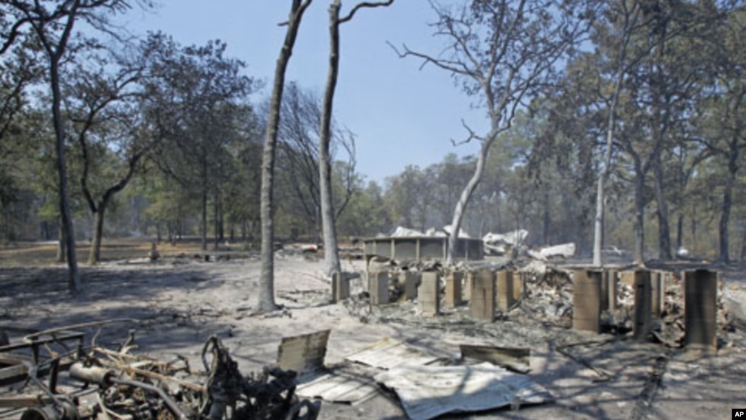 A pier foundation and pool are among the remains of a home destroyed when a wildfire swept through Bastrop, Texas, September 6, 2011.