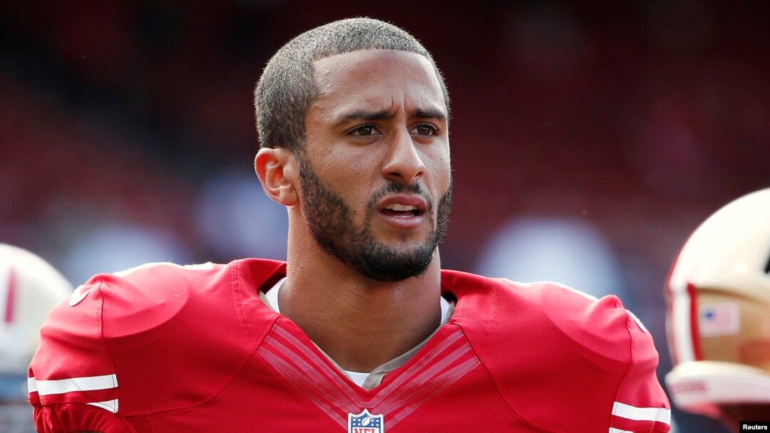 FILE - San Francisco 49ers quarterback Colin Kaepernick stands on the field before their NFL pre-season football game against the Denver Broncos in San Francisco, California.