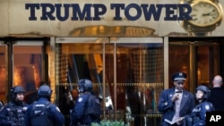 FILE - Members of the New York Police Department's counterterrorism unit guard Trump Tower, in New York City, Nov. 14, 2016.