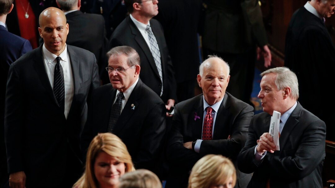 From left to right: Sen. Cory Booker, D-N.J., Sen. Robert Menendez, D-N.J., Sen. Ben Cardin, D-Md., and Sen. Richard Durbin, D-Ill., wait for the arrival of President Donald Trump to deliver his State of the Union address to a joint session of Congress, Jan. 30, 2018. 