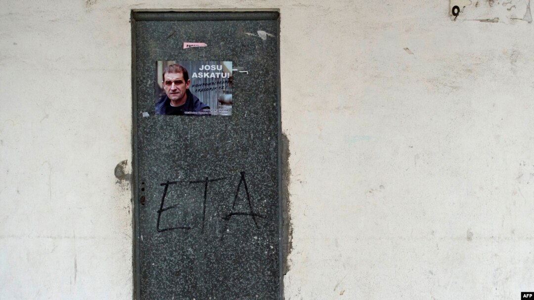 FILE - A poster is pasted on a door calling for the release of one of the most influential leaders of former Basque separatist group ETA, Josu Ternera, in the Spanish Basque village of Miraballes, May 16, 2019, after he was arrested in France. 