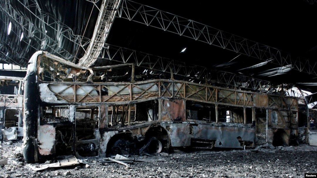 Destroyed buses are seen after a fire in a parking lot in San Cristobal, Venezuela May 17, 2017. 