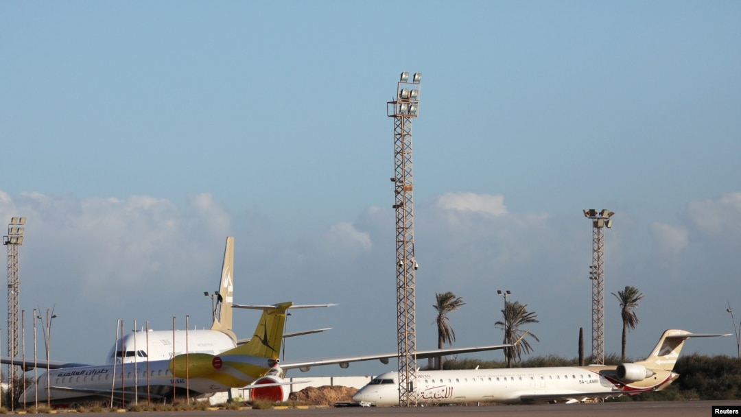 FILE - Planes are seen at Mitiga Airport in Tripoli, Libya, Dec. 12, 2019.